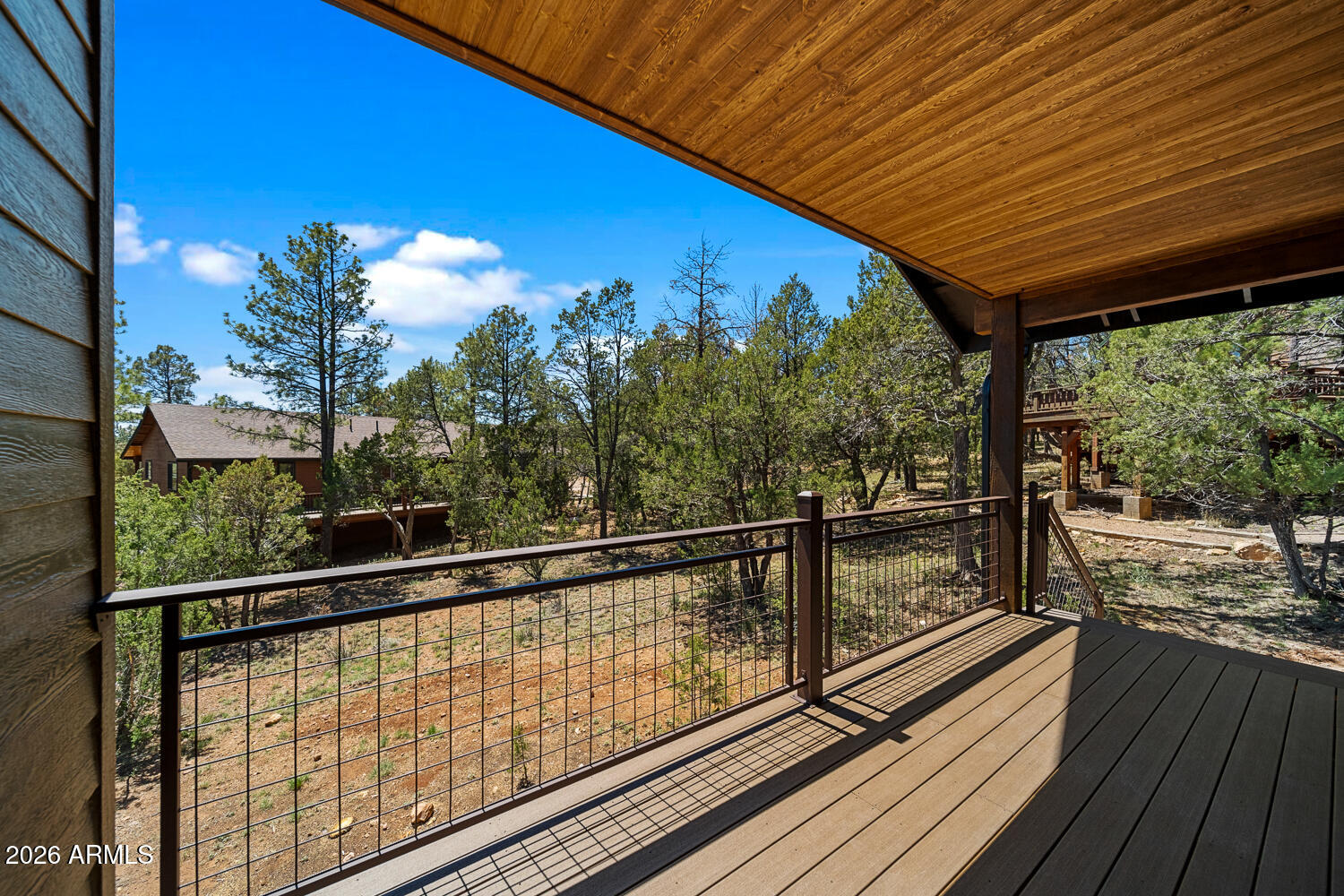 2235 Par Place Overgaard, AZ 85933 - Photo 9 of 42 a view of balcony with floor to ceiling window wooden floor
