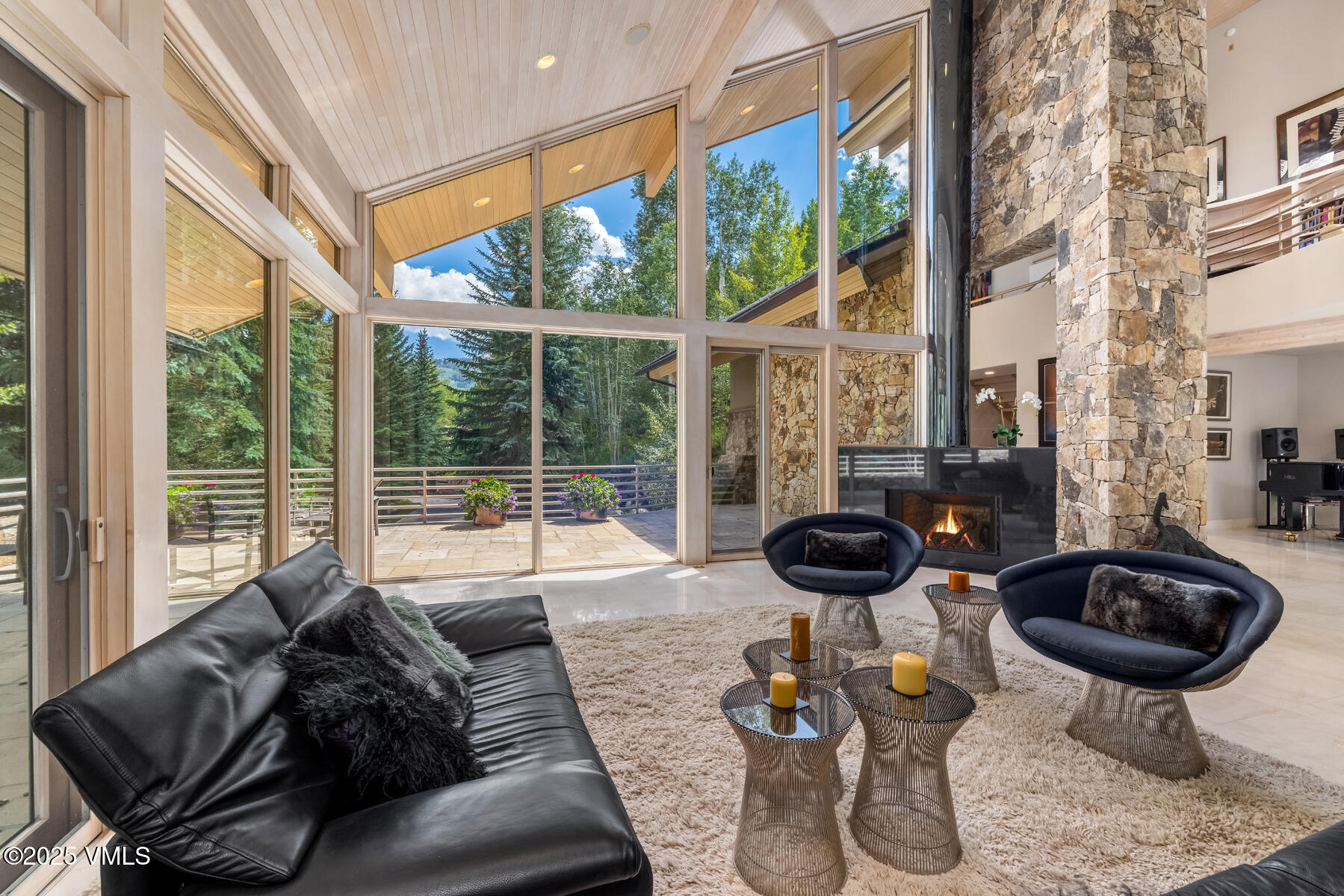 334 Borders Road Beaver Creek, CO 81620 - Photo 12 of 62 a living room with furniture and a floor to ceiling window
