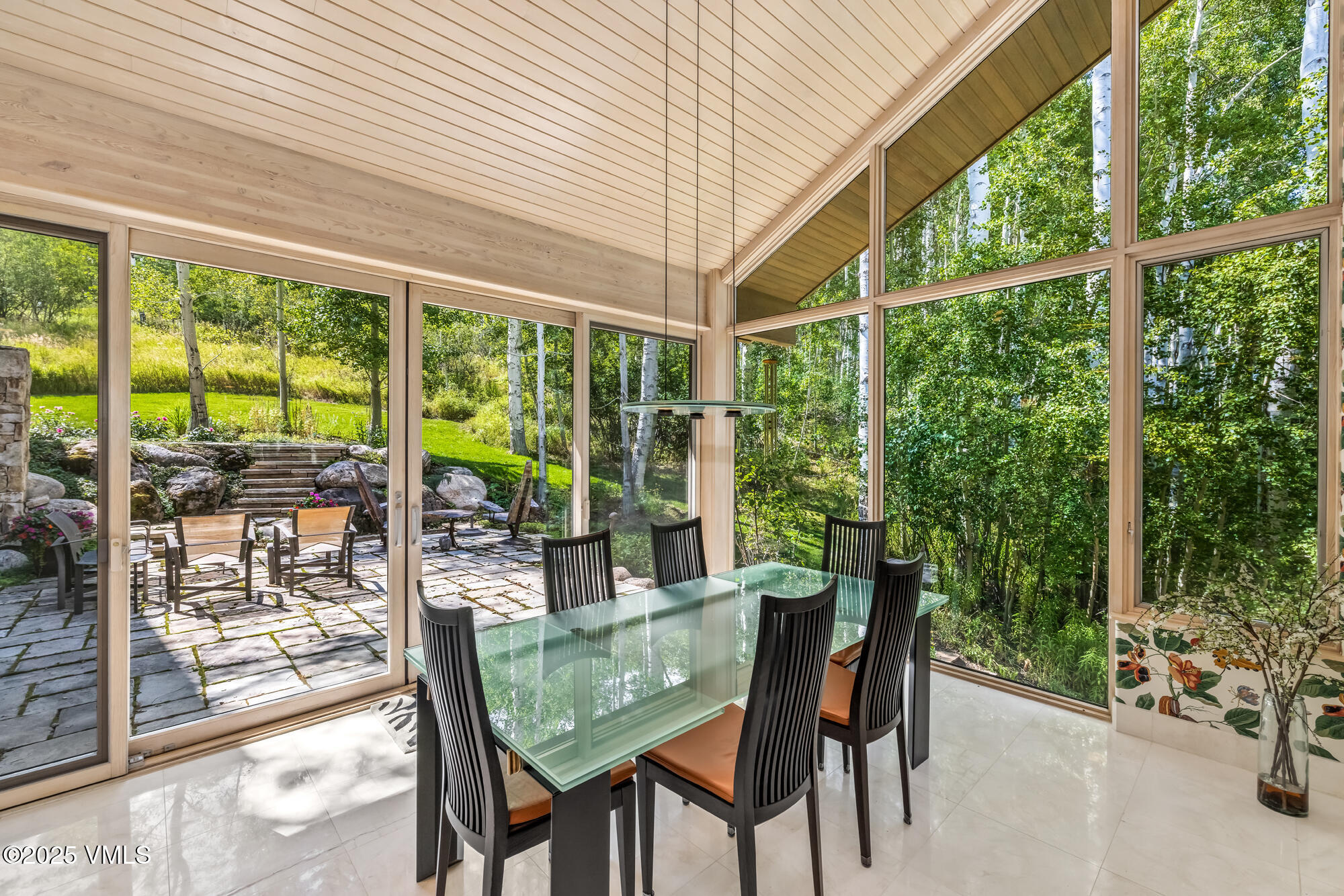 334 Borders Road Beaver Creek, CO 81620 - Photo 19 of 62 a dining room with furniture and garden view