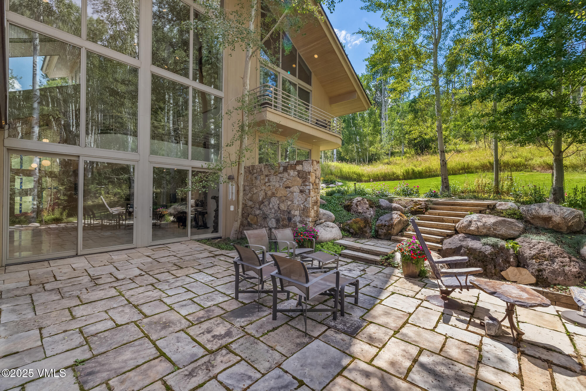 334 Borders Road Beaver Creek, CO 81620 - Photo 20 of 62 a view of a chairs and table in backyard