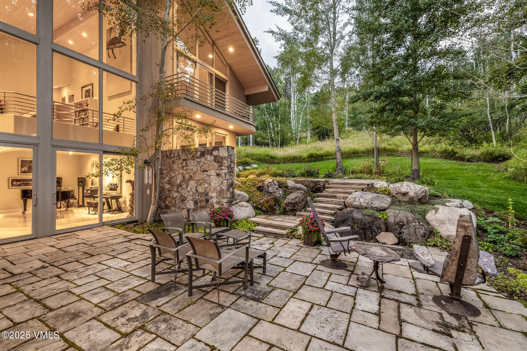 334 Borders Road Beaver Creek, CO 81620 - Photo 3 of 62 a view of a chairs and tables in the yard