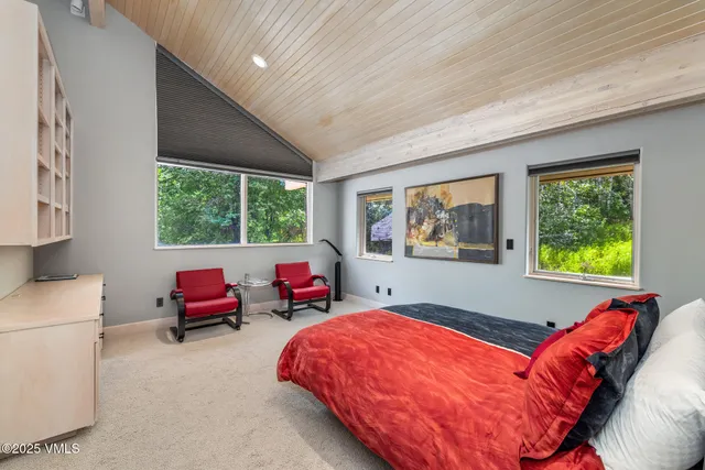 a view of a balcony with wooden floor and fence