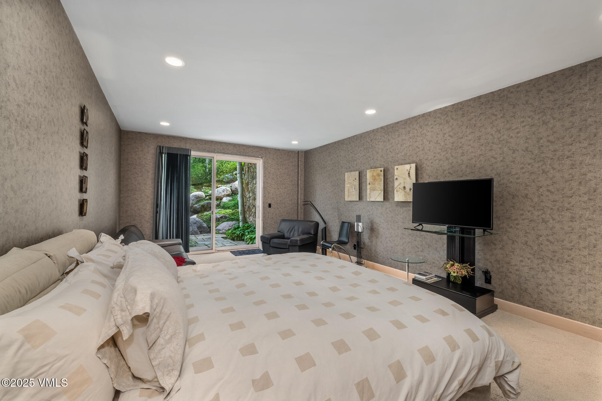 334 Borders Road Beaver Creek, CO 81620 - Photo 43 of 62 a bedroom with a bed and a flat screen tv