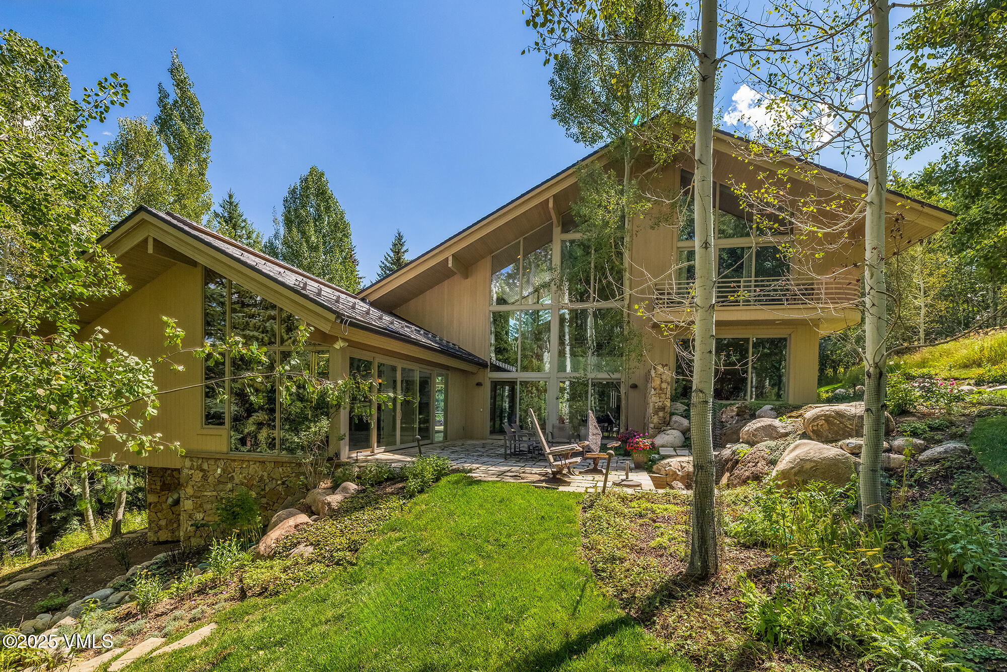 334 Borders Road Beaver Creek, CO 81620 - Photo 49 of 62 a view of a house with backyard and sitting area