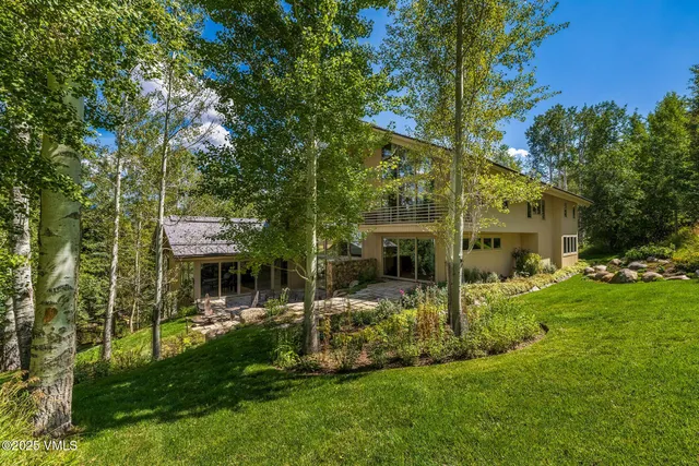 a view of house with outdoor space and sitting area