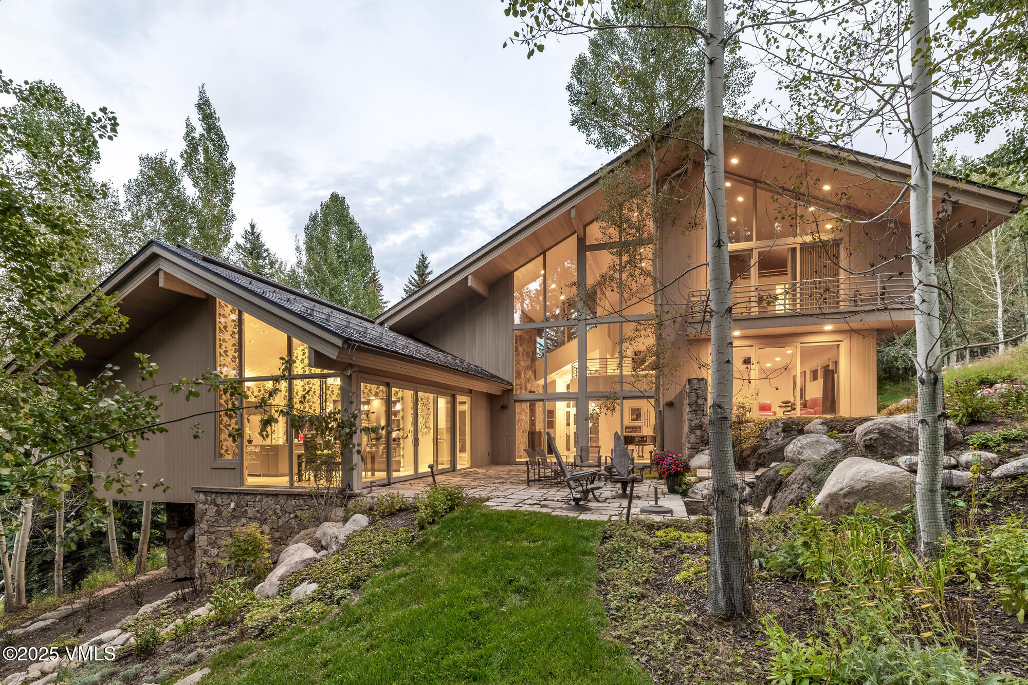 334 Borders Road Beaver Creek, CO 81620 - Photo 6 of 62 a view of backyard of house with outdoor seating and green space