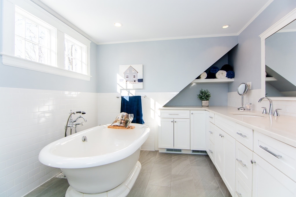 1289 Walnut Street Newton, MA 02461 - Photo 20 of 42 a spacious bathroom with a sink double vanity and a mirror