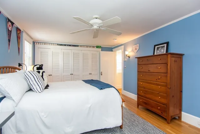 a bedroom with a bed and a dresser