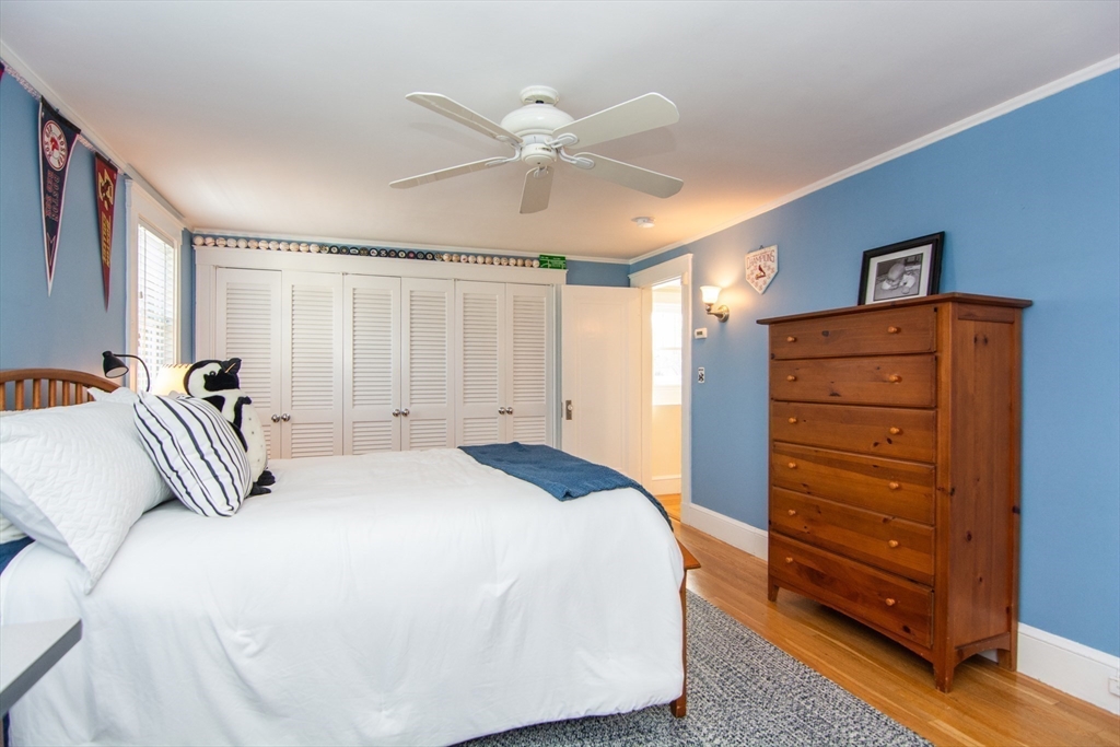 1289 Walnut Street Newton, MA 02461 - Photo 24 of 42 a bedroom with a bed and a dresser