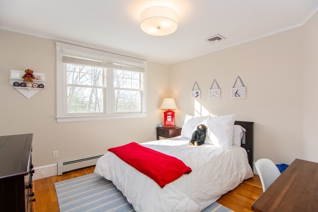 1289 Walnut Street Newton, MA 02461 - Photo 25 of 42 a bedroom with a bed and a window