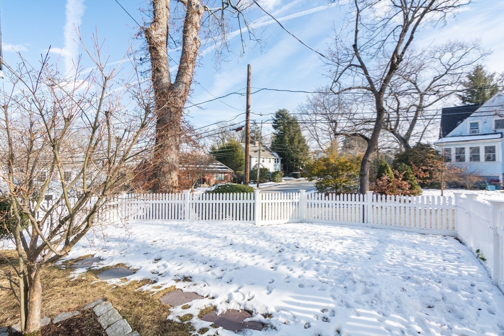 1289 Walnut Street Newton, MA 02461 - Photo 36 of 42 a balcony with white fence and trees