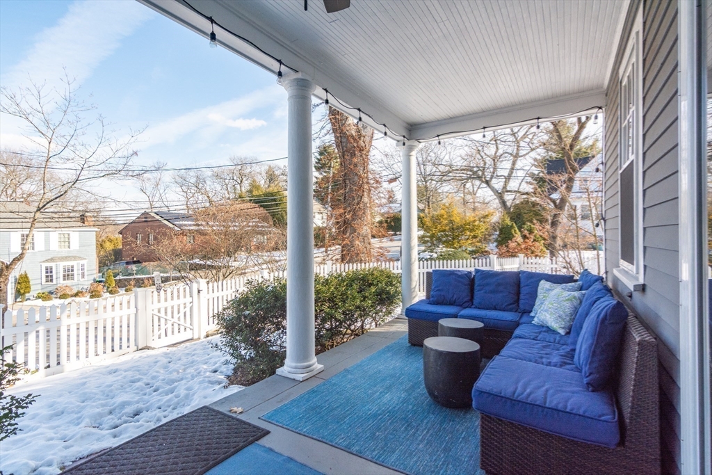 1289 Walnut Street Newton, MA 02461 - Photo 40 of 42 a living room with furniture and a floor to ceiling window