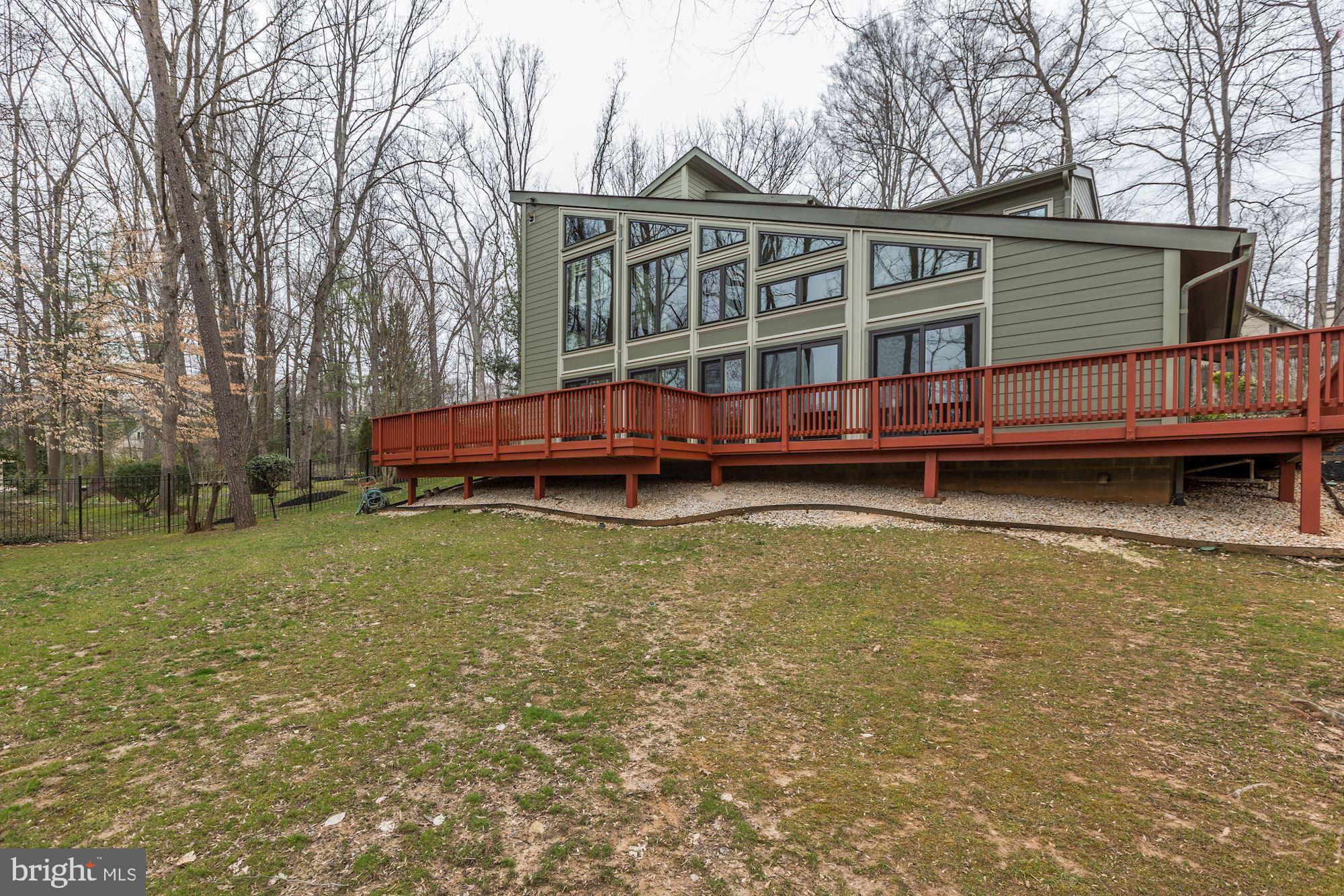 8707 Burning Tree Road Bethesda, MD 20817 - Photo 69 of 69 Rear exterior with huge deck and so many windows!