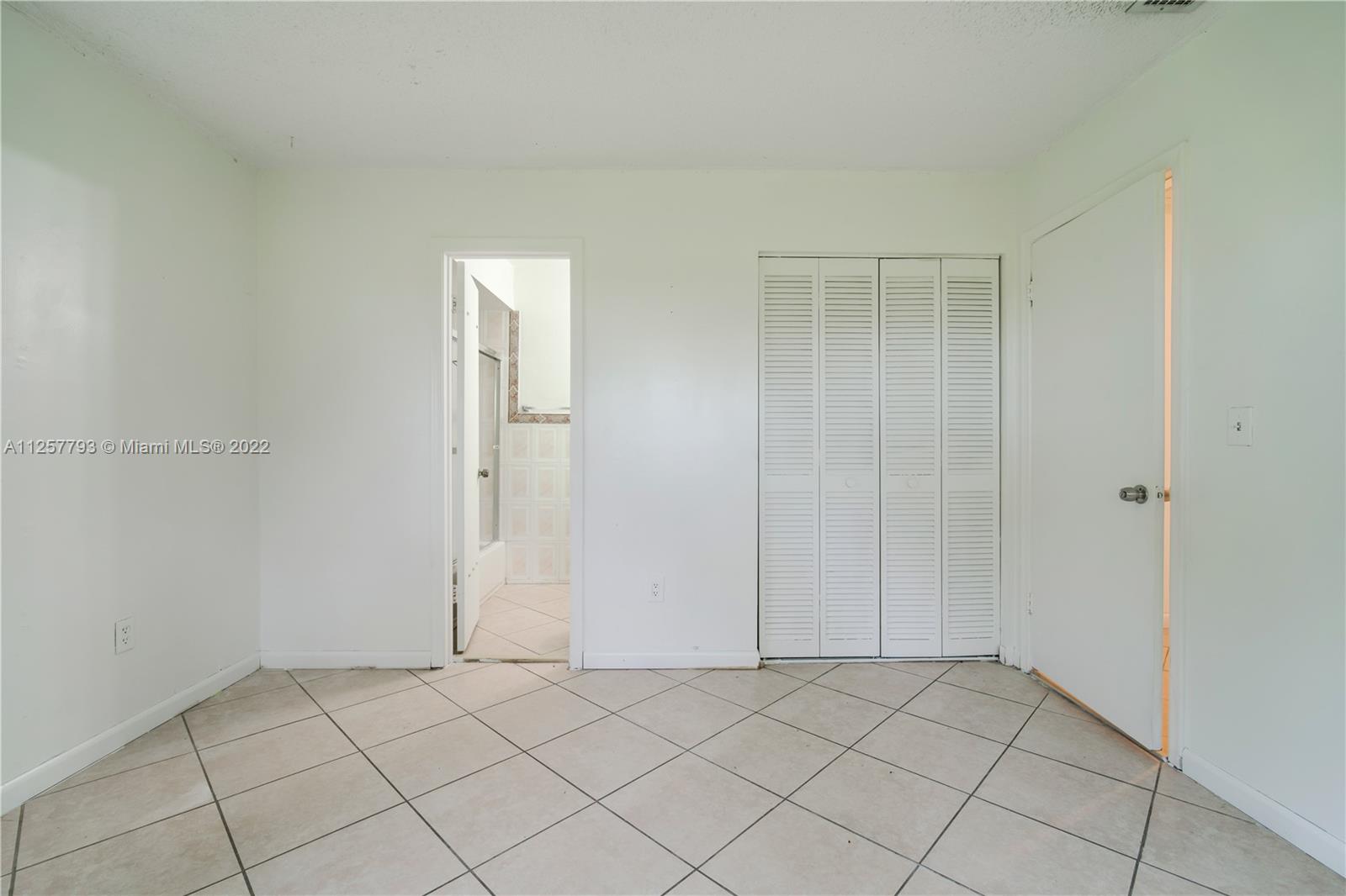 14121 Southwest 47th Street Miami, FL 33175 - Photo 15 of 45 an empty room with windows