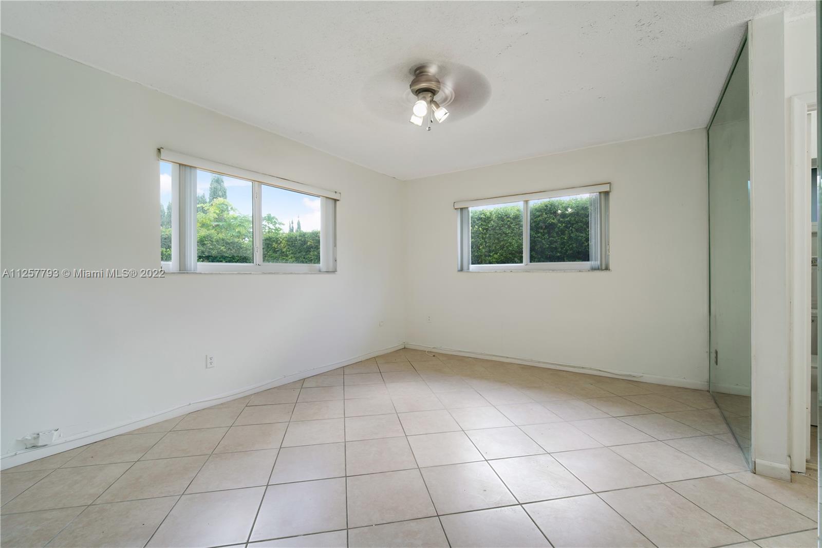 14121 Southwest 47th Street Miami, FL 33175 - Photo 17 of 45 a view of an empty room with a window