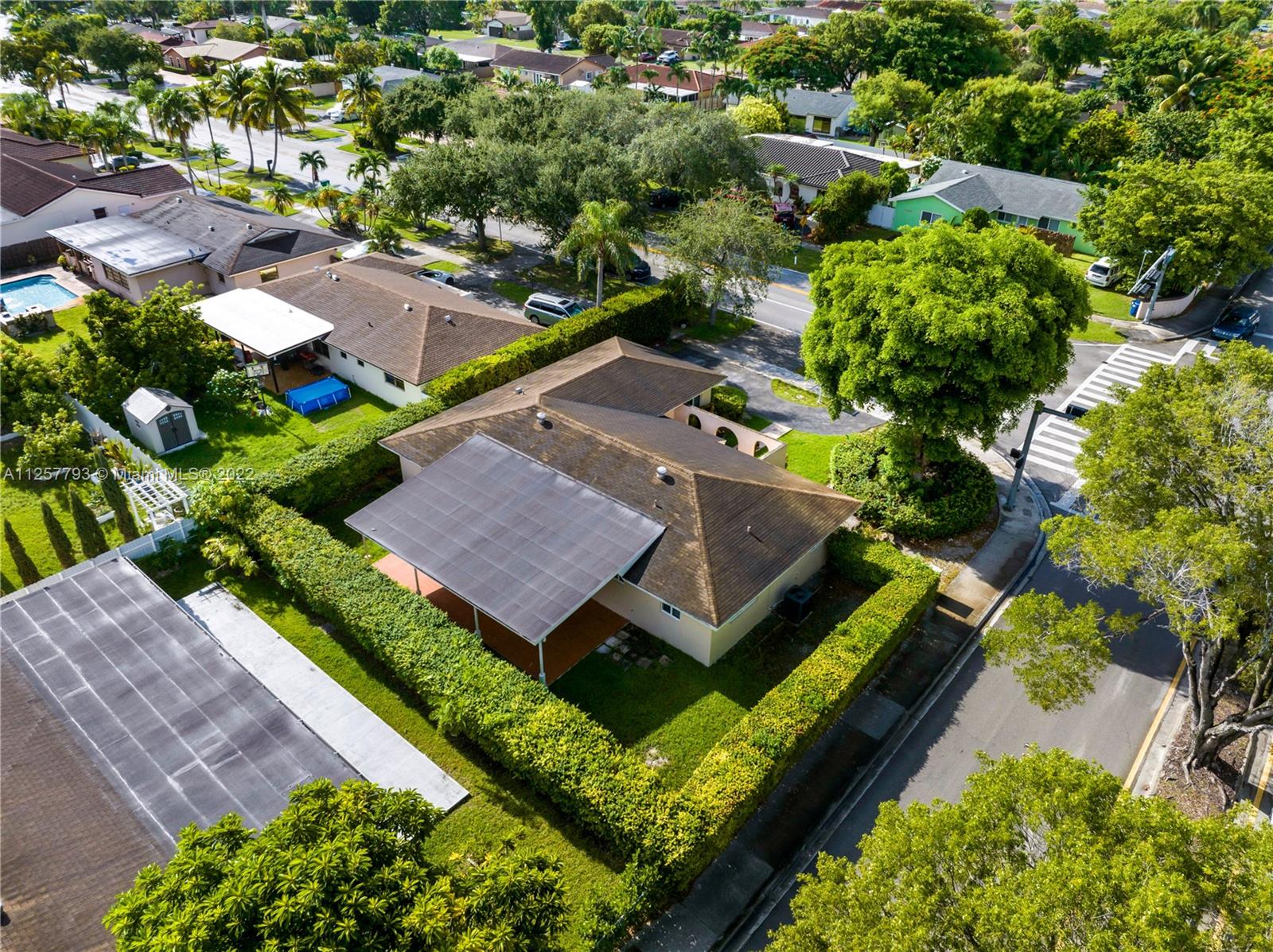14121 Southwest 47th Street Miami, FL 33175 - Photo 2 of 45 an aerial view of a house with a garden