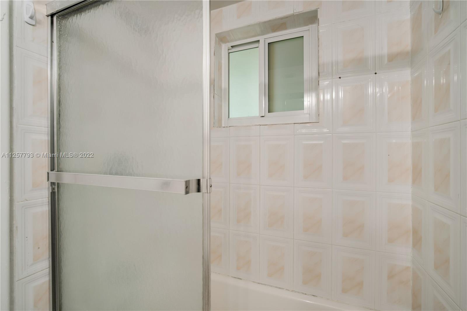 14121 Southwest 47th Street Miami, FL 33175 - Photo 23 of 45 a bathroom with a shower