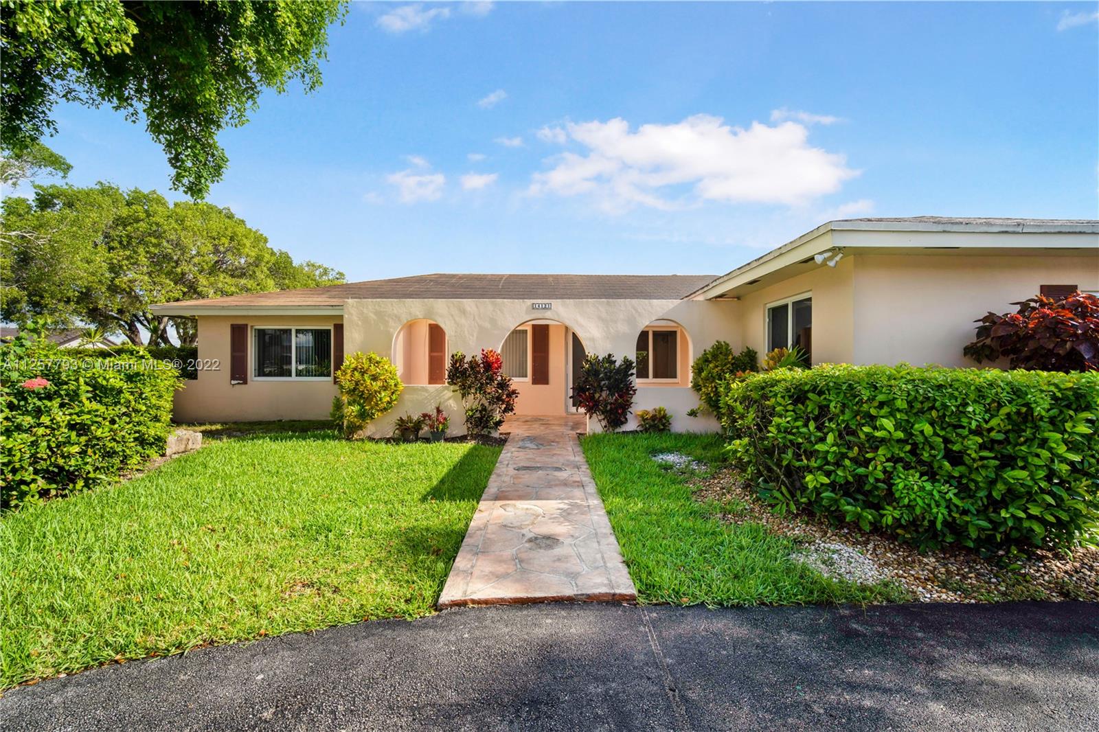 14121 Southwest 47th Street Miami, FL 33175 - Photo 3 of 45 a front view of house with yard and green space