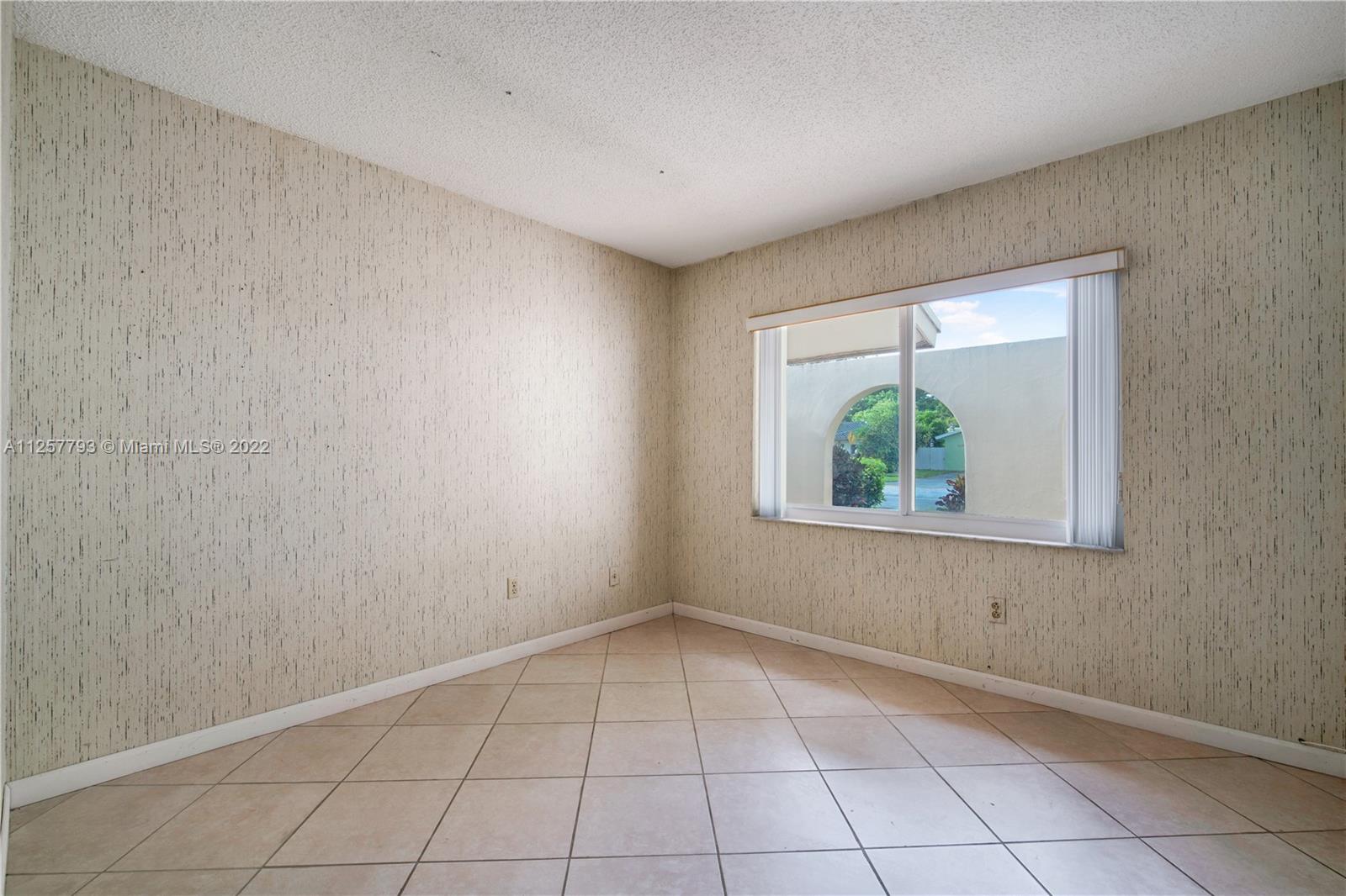 14121 Southwest 47th Street Miami, FL 33175 - Photo 32 of 45 an empty room with window