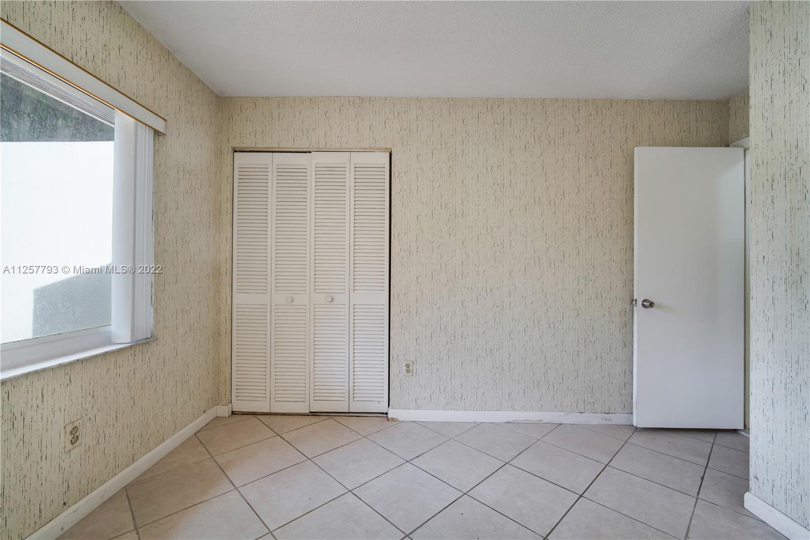 14121 Southwest 47th Street Miami, FL 33175 - Photo 34 of 45 a view of an empty room and window