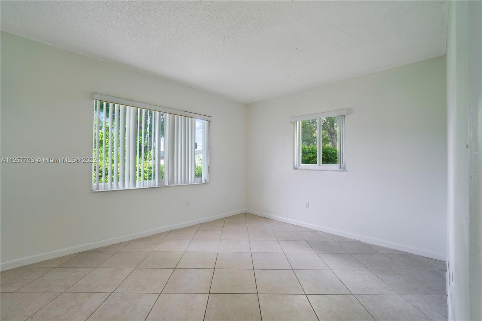 14121 Southwest 47th Street Miami, FL 33175 - Photo 35 of 45 an empty room with windows