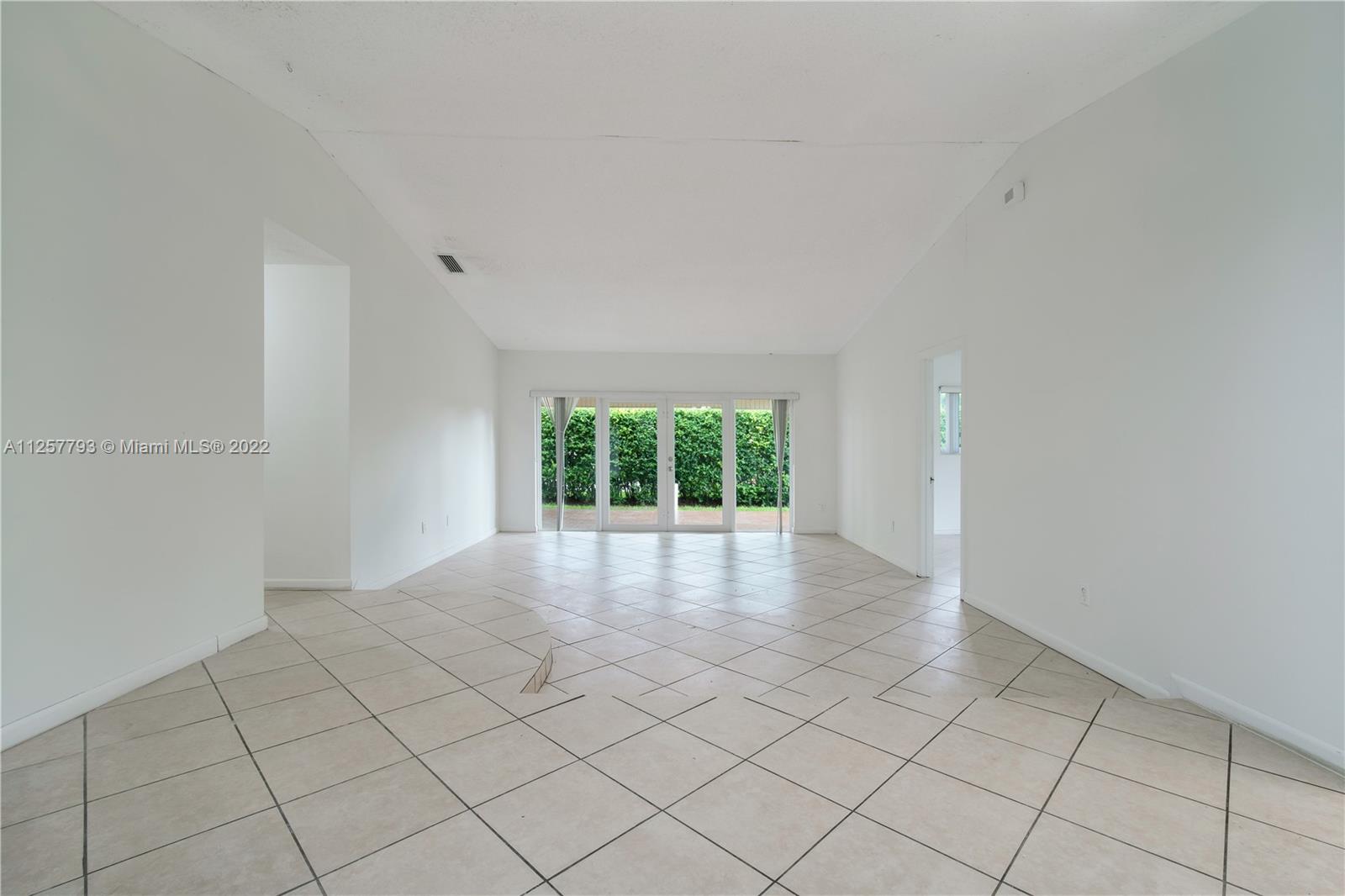 14121 Southwest 47th Street Miami, FL 33175 - Photo 7 of 45 a view of an empty room with a window