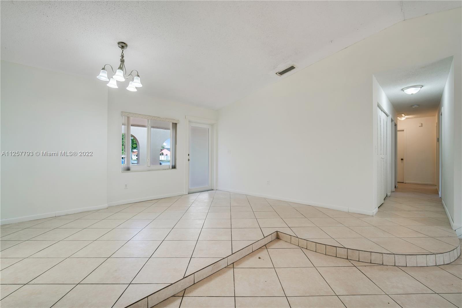 14121 Southwest 47th Street Miami, FL 33175 - Photo 9 of 45 a view of an empty room with window