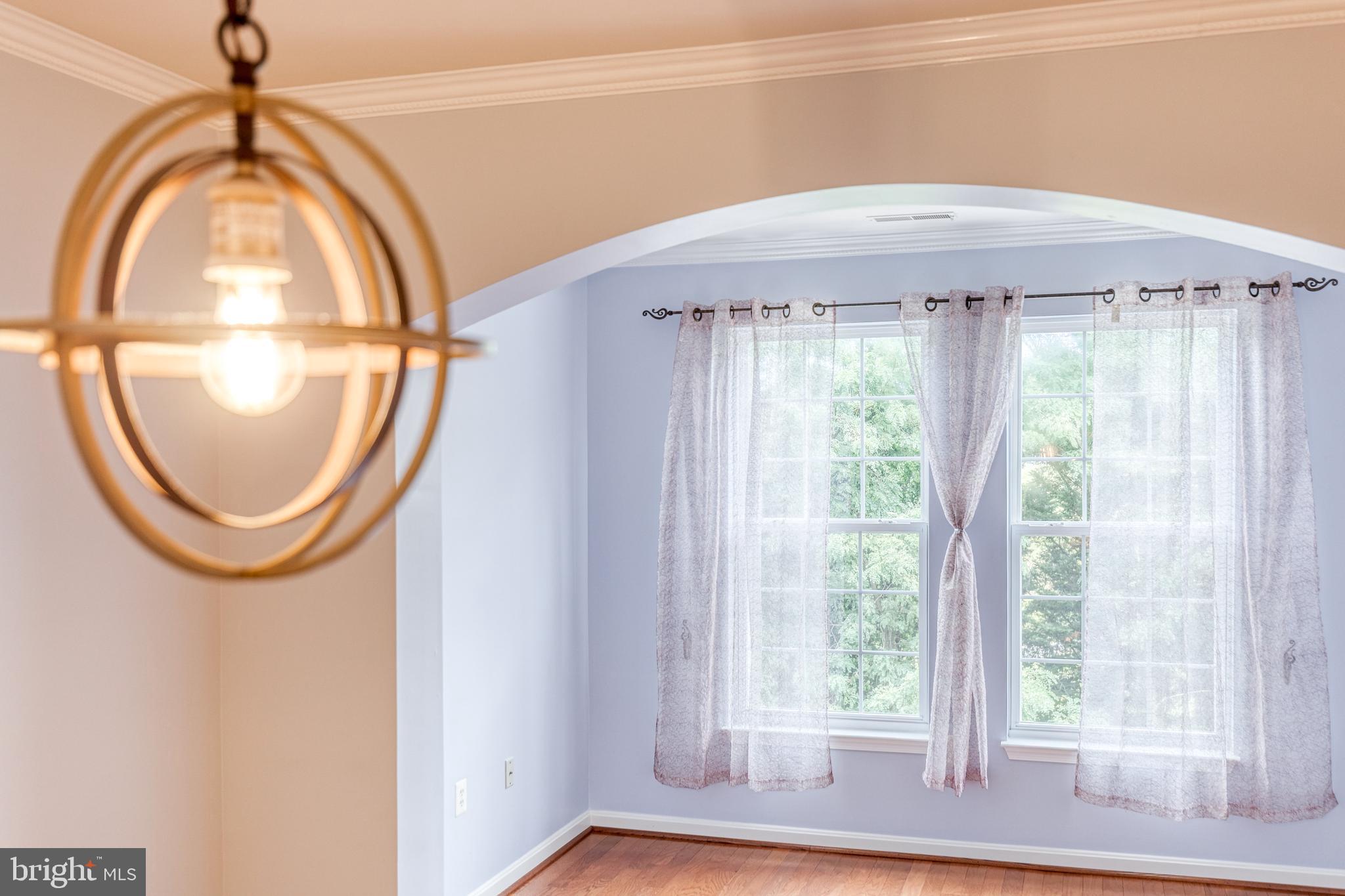 400 Symphony Circle, Unit 406 Hunt Valley, MD 21030 - Photo 17 of 37 a front view of a house with garden