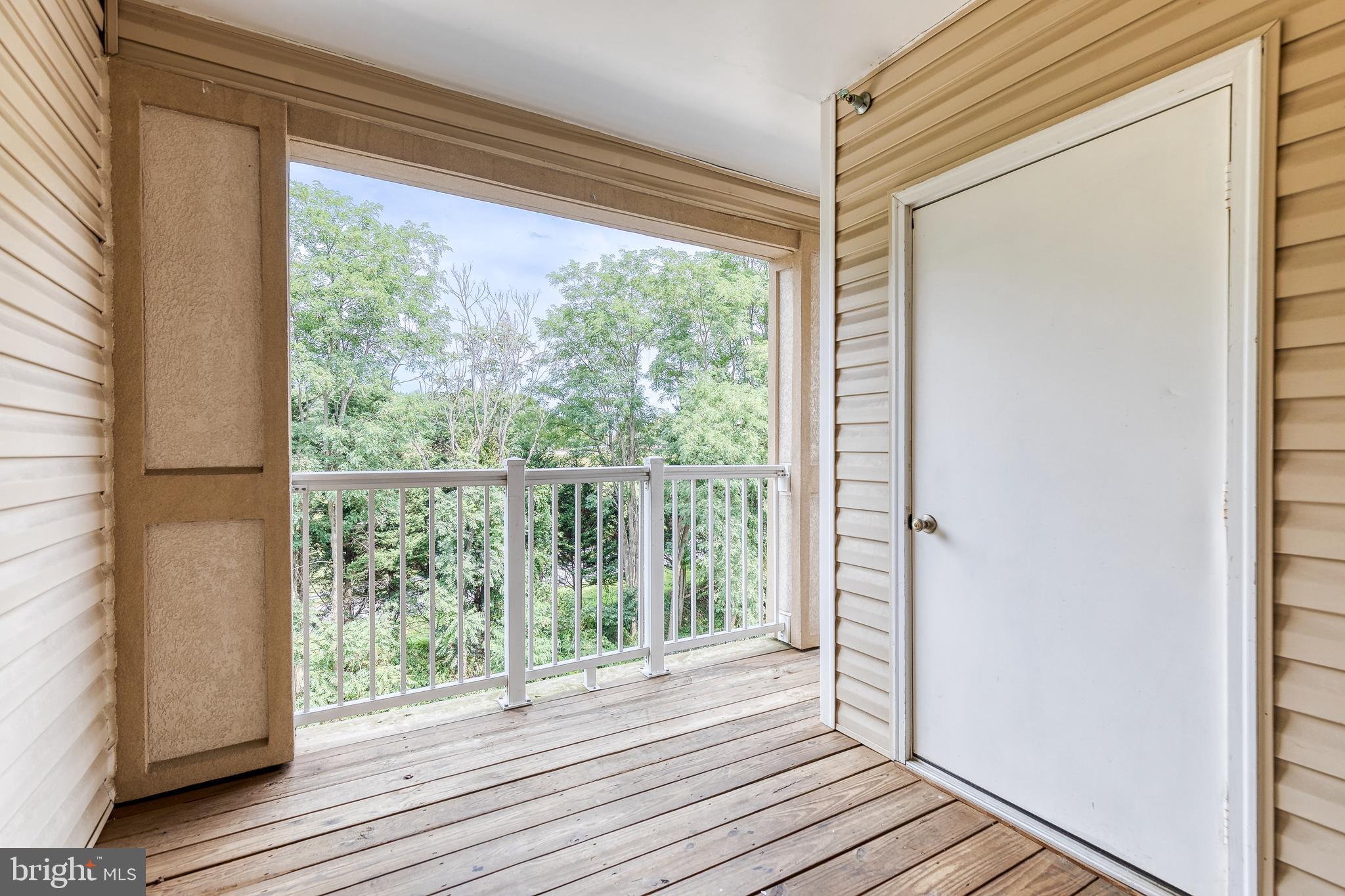 400 Symphony Circle, Unit 406 Hunt Valley, MD 21030 - Photo 25 of 37 a view of a room with wooden floor and windows