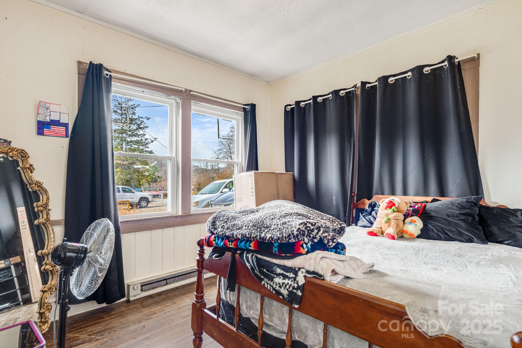 5454 Ela Road Whittier, NC 28789 - Photo 13 of 41 a bedroom with a bed and a window