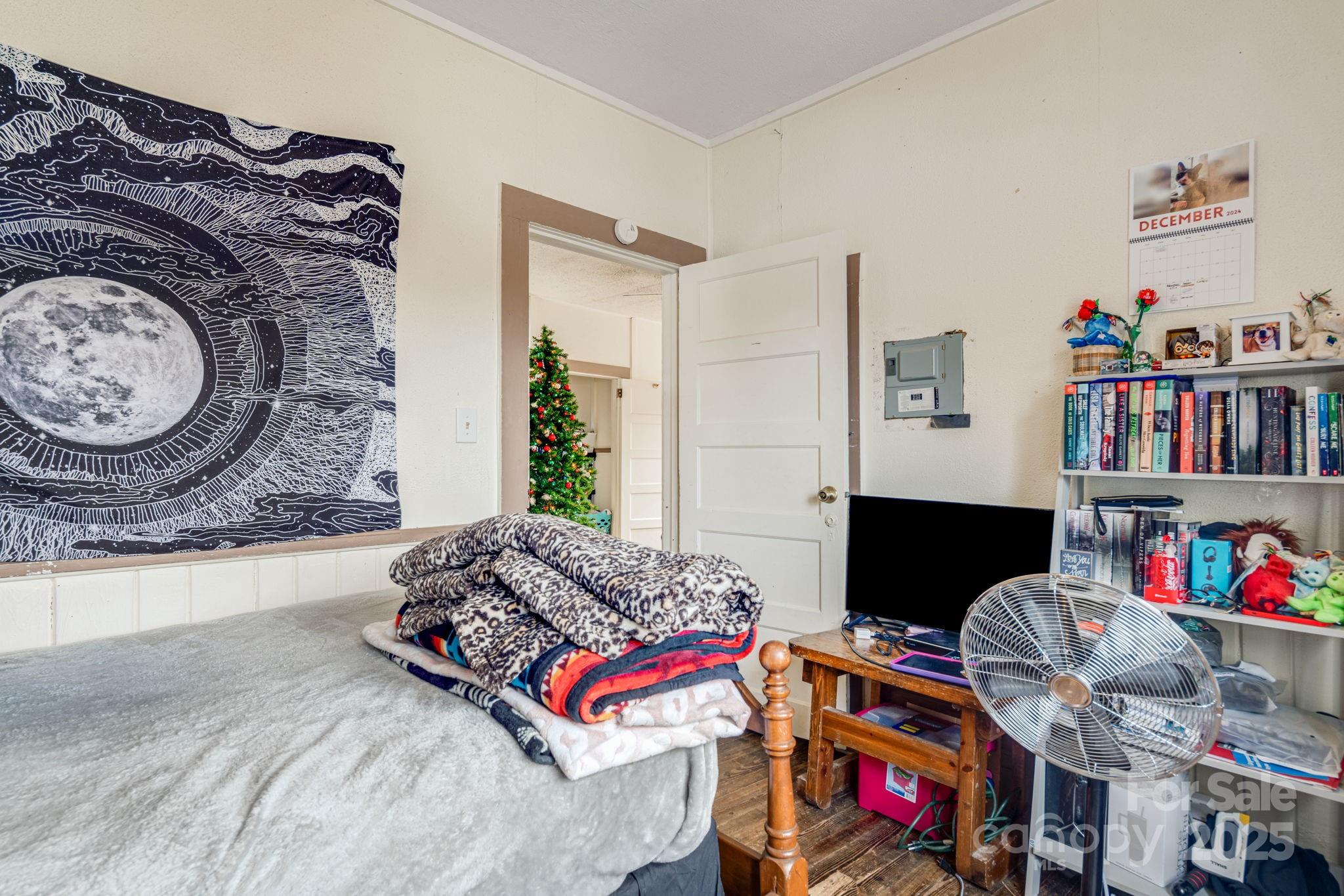 5454 Ela Road Whittier, NC 28789 - Photo 14 of 41 a living room with baby toys and a couch