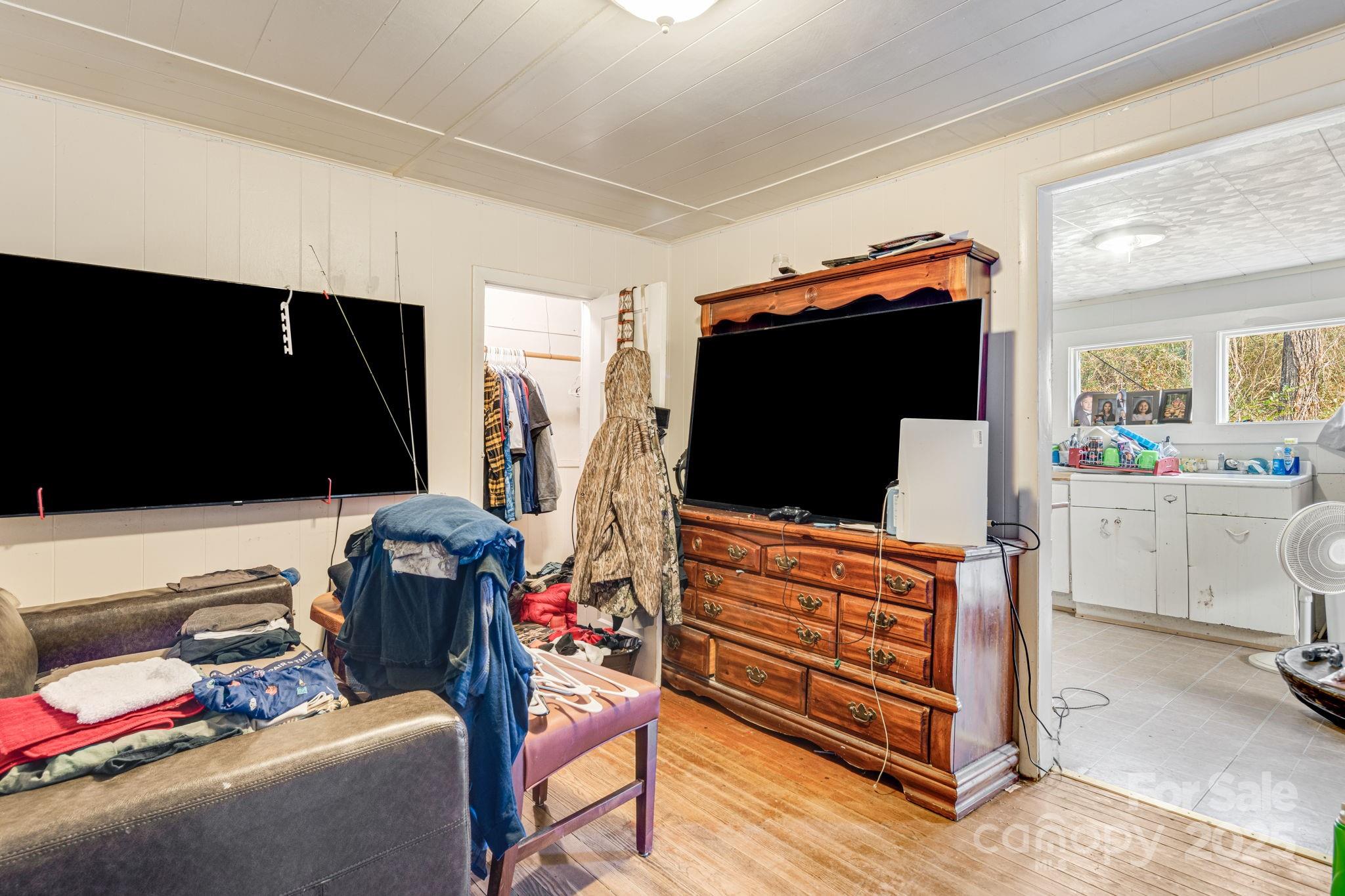 5454 Ela Road Whittier, NC 28789 - Photo 20 of 41 a living room with furniture and a flat screen tv