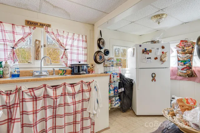 a kitchen with a refrigerator and countertop
