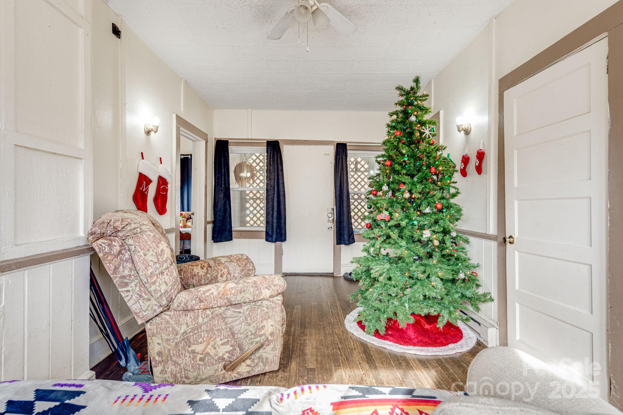 5454 Ela Road Whittier, NC 28789 - Photo 7 of 41 a living room with furniture and a potted plant