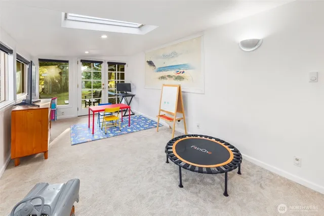 a bathroom with a sink toilet vanity and shower