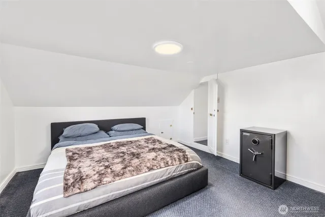 a bathroom with a shower sink and mirror