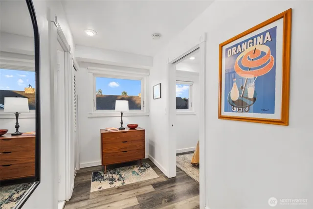 a spacious bedroom with a bed and a flat screen tv