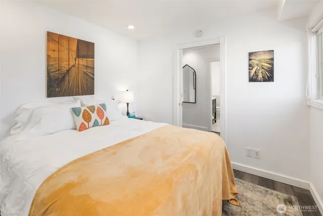 a bedroom with furniture and windows