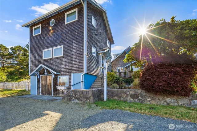 a view of a livingroom with furniture and staircase