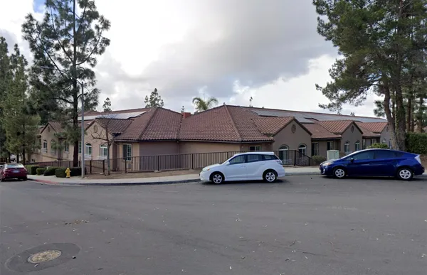a car parked in front of a house