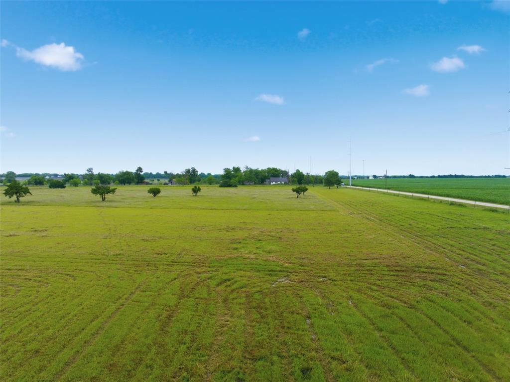 Tbd Wade Road Eddy, TX 76524 - Photo 5 of 12 Expansive green field with scattered trees and a distant building