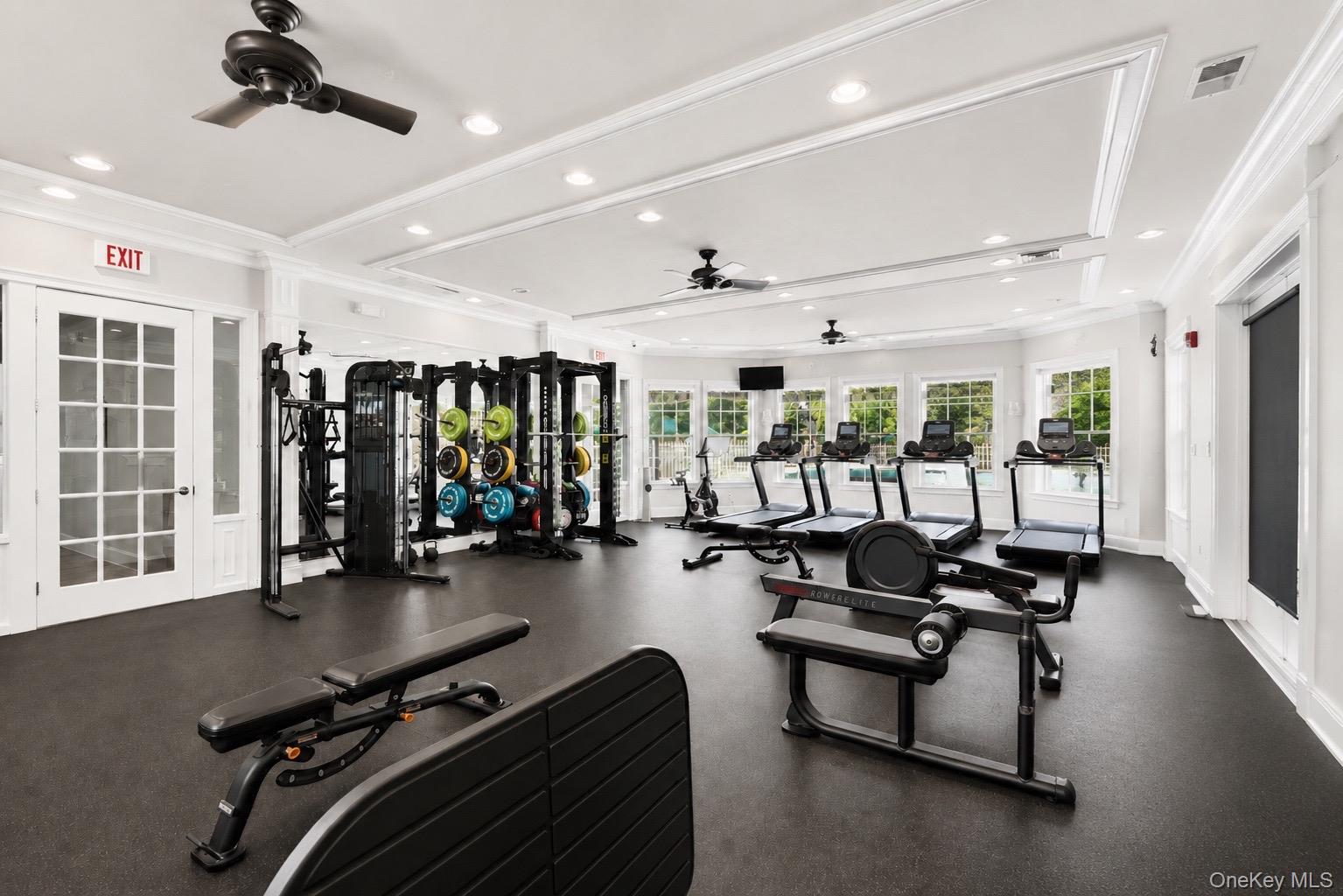 323 Waterside Close Peekskill, NY 10566 - Photo 28 of 42 Totally updated fitness center in the clubhouse featuring recessed lighting, tray ceilings, and a series of large windows over looking the pool.