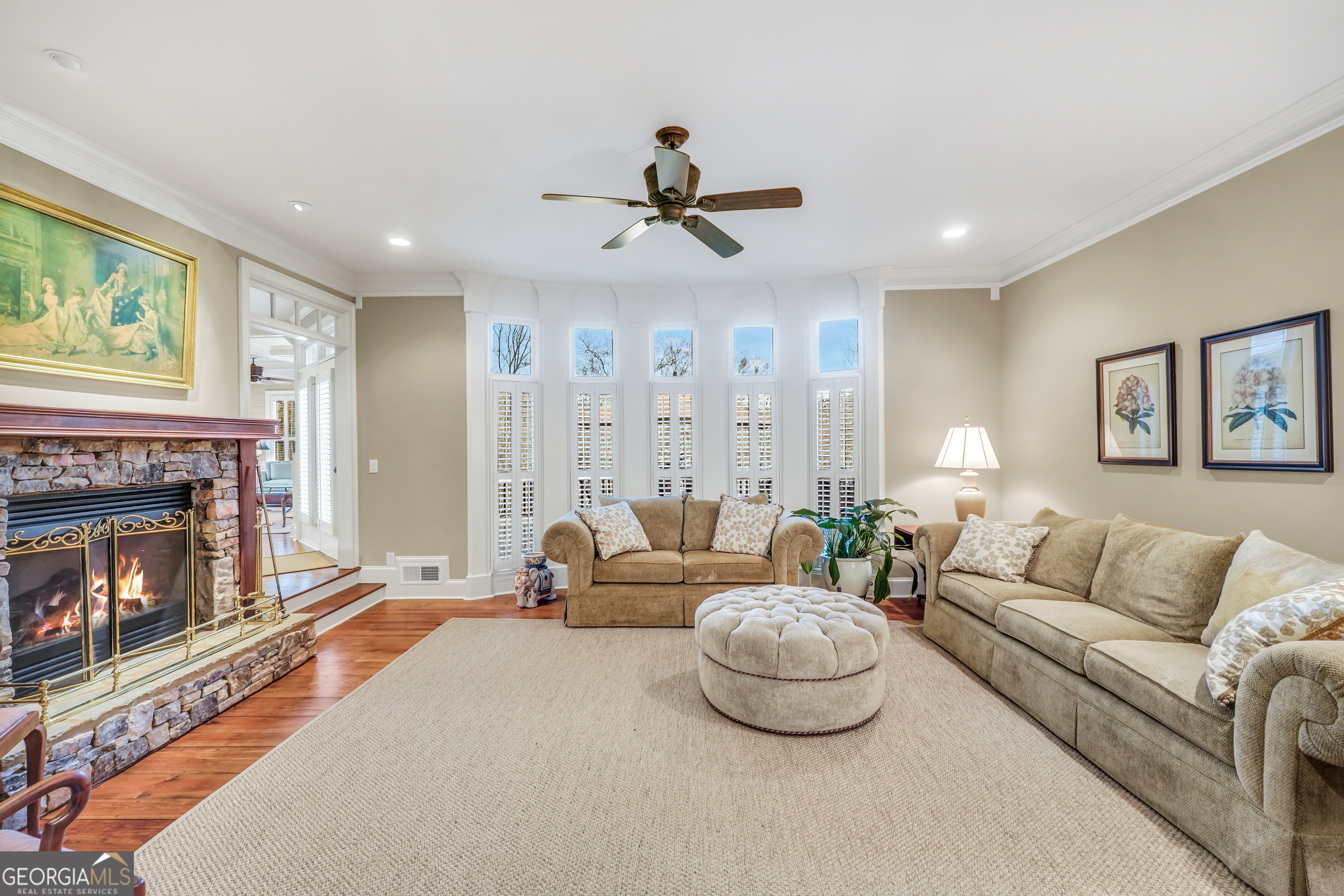 610 Elliott Road McDonough, GA 30252 - Photo 13 of 92 a living room with furniture a fireplace and a flat screen tv