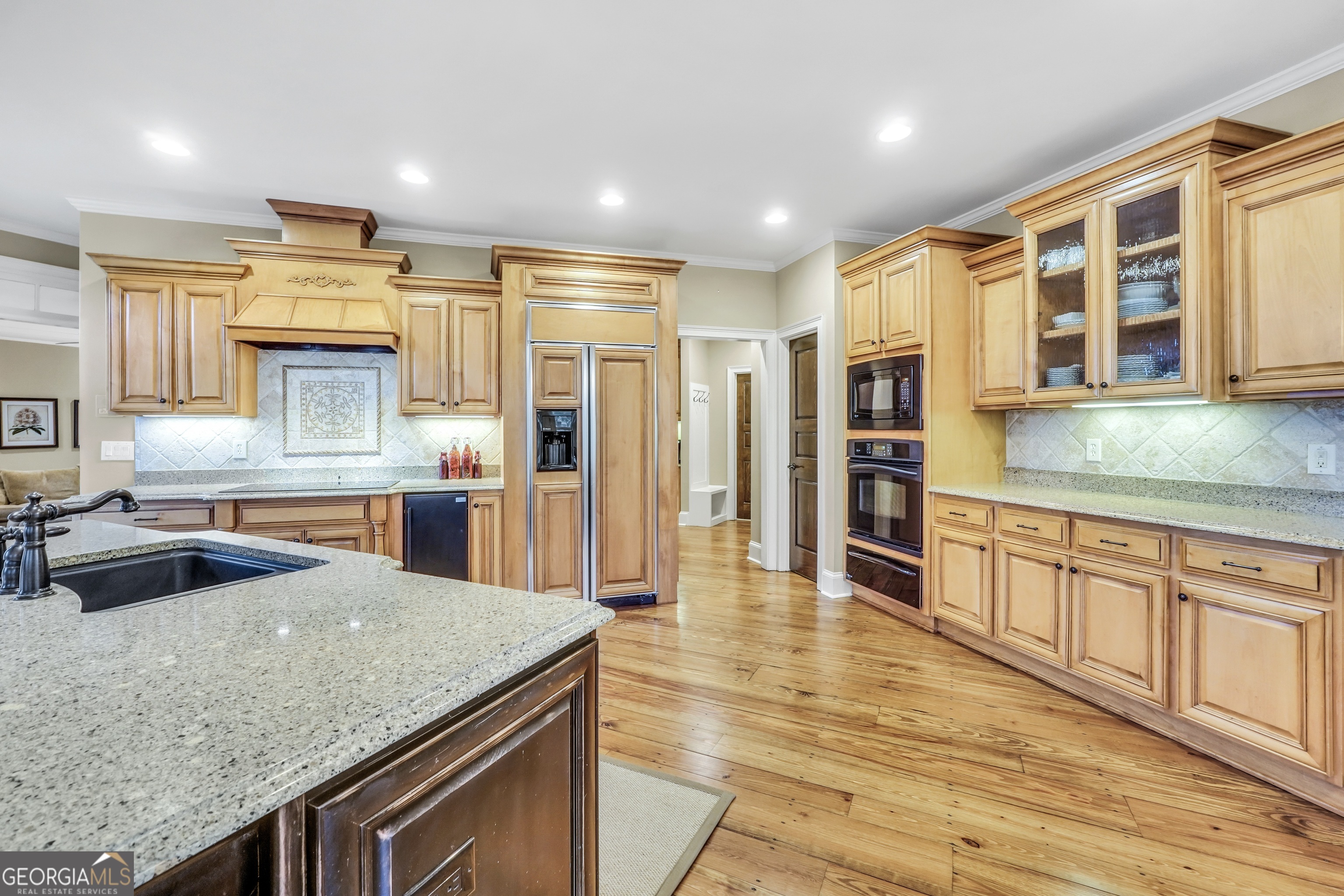 610 Elliott Road McDonough, GA 30252 - Photo 20 of 92 a kitchen with stainless steel appliances granite countertop a sink and a stove