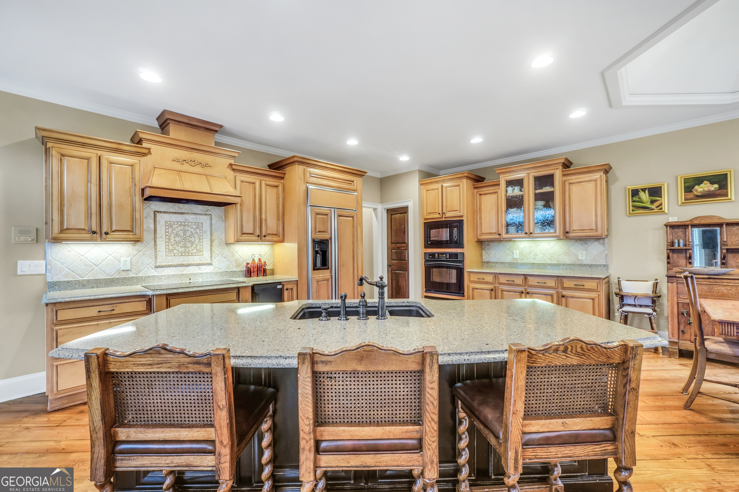 610 Elliott Road McDonough, GA 30252 - Photo 21 of 92 a kitchen with stainless steel appliances granite countertop a stove and cabinets