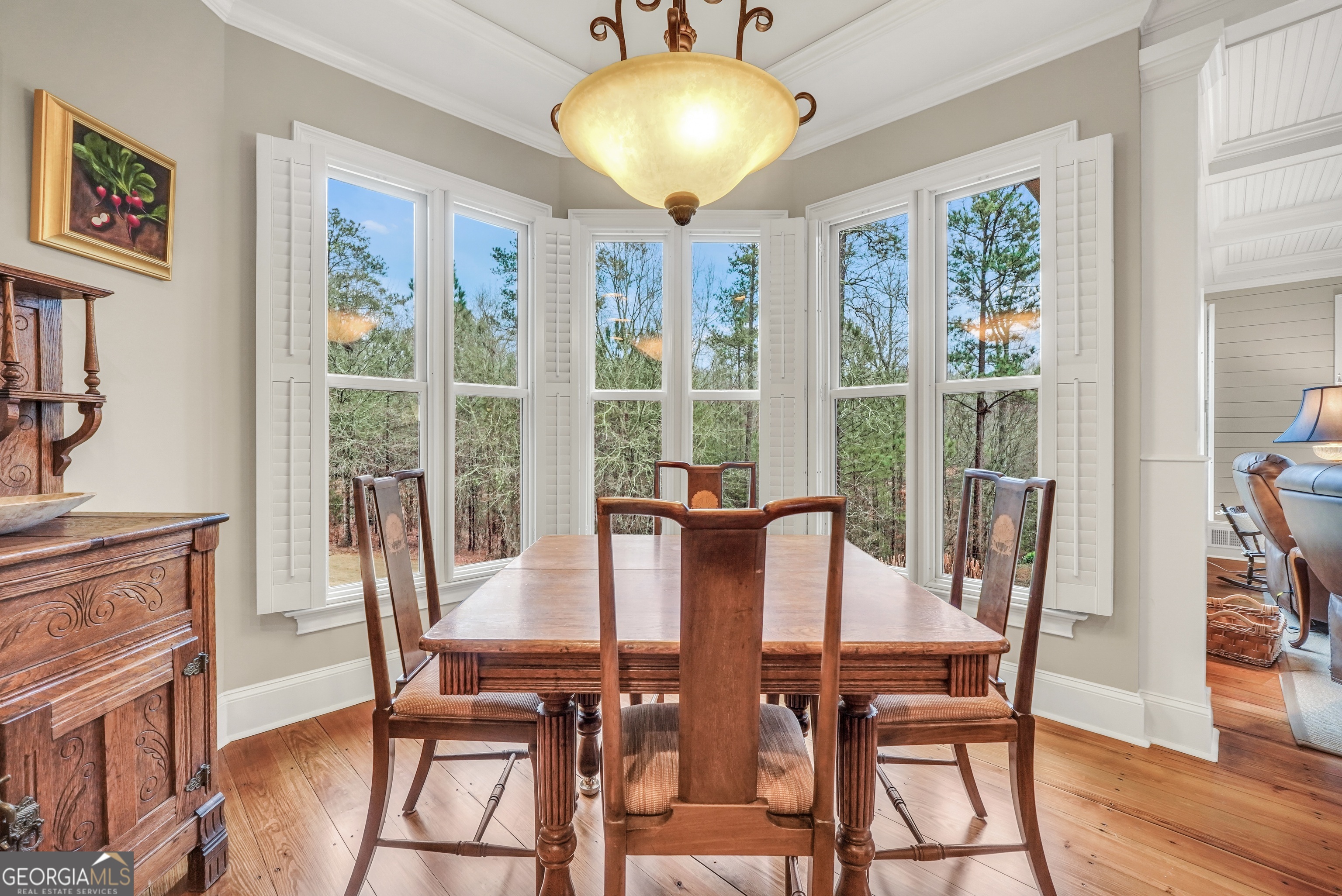 610 Elliott Road McDonough, GA 30252 - Photo 22 of 92 a view of a dining room with furniture window and wooden floor