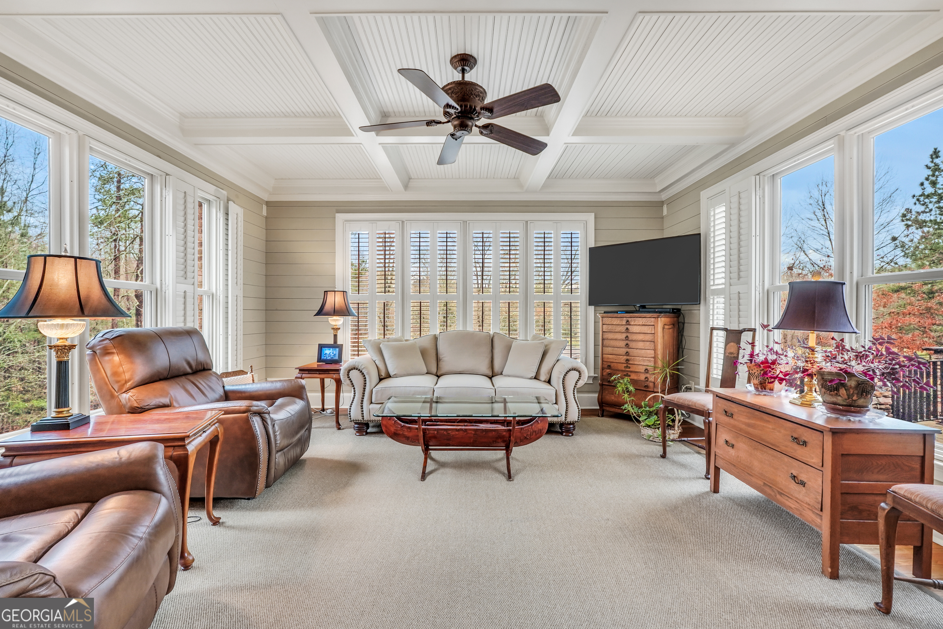 610 Elliott Road McDonough, GA 30252 - Photo 23 of 92 a living room with furniture a large window and a flat screen tv