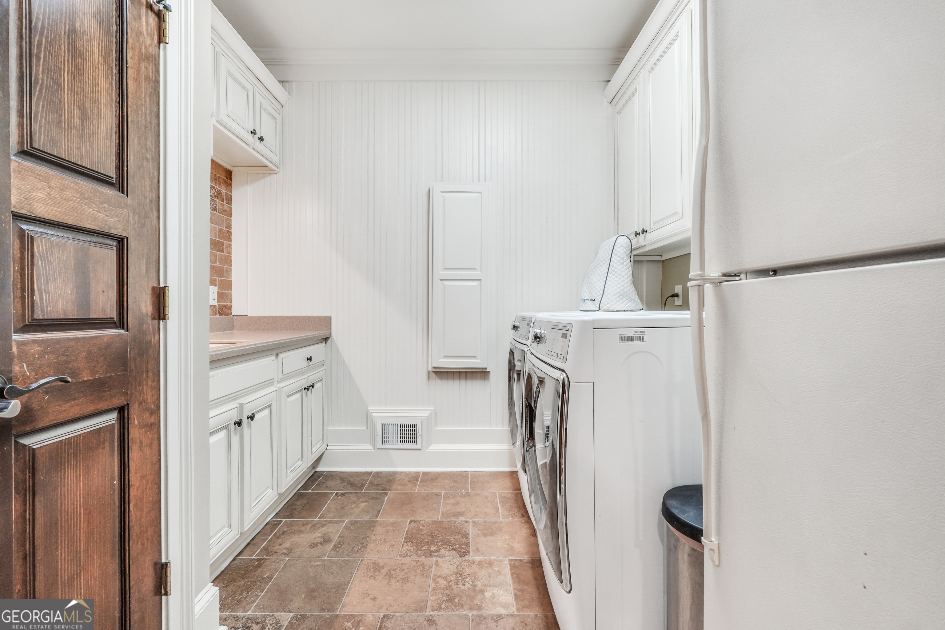 610 Elliott Road McDonough, GA 30252 - Photo 27 of 92 a bathroom with a sink a washer and dryer