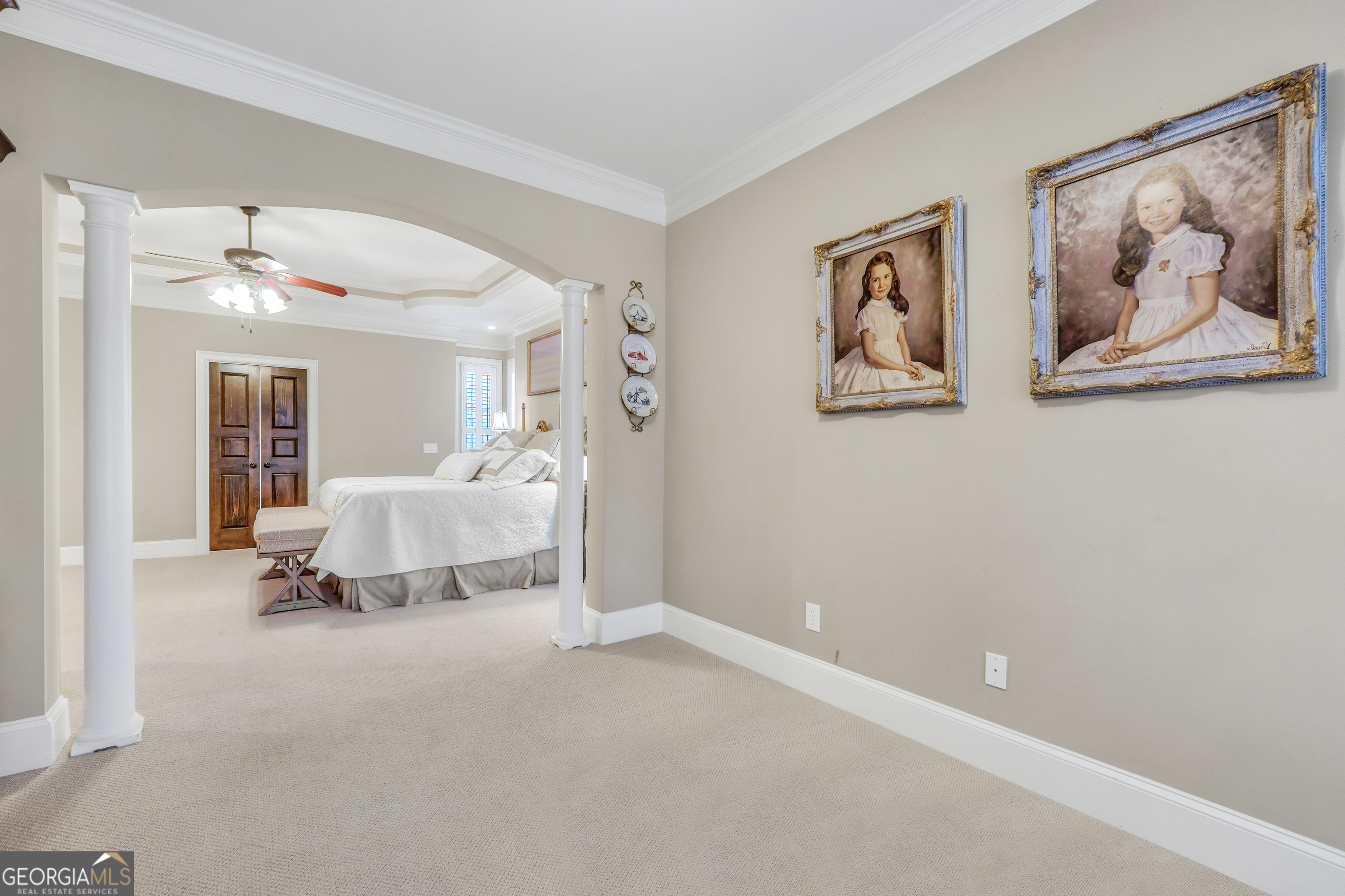 610 Elliott Road McDonough, GA 30252 - Photo 34 of 92 a spacious bedroom with a bed and a painting on the wall