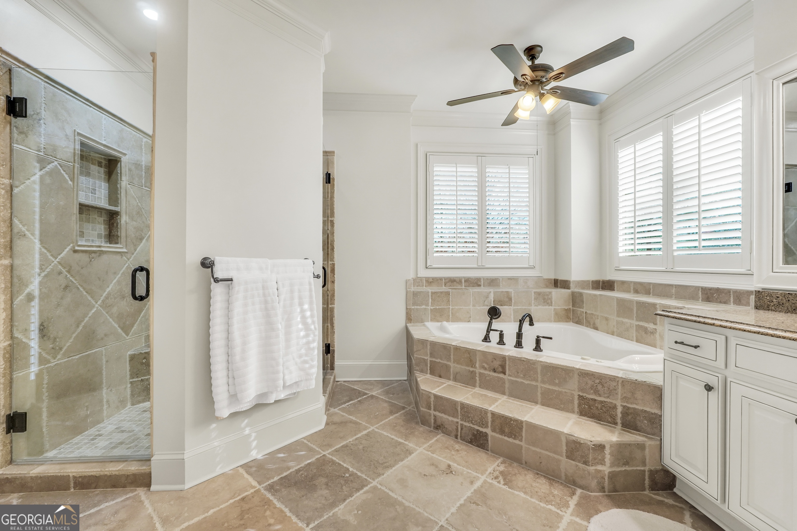 610 Elliott Road McDonough, GA 30252 - Photo 36 of 92 a spacious bathroom with a tub sink and mirror